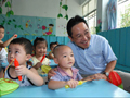 Mr Chen joins students attending classes at a temporary campus of Chongzhou Zhengdong Jie Kindergarten.