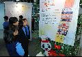 Students from Tai Po Old Market Public School take an interest in a display detailing the HKSAR's reconstruction efforts.