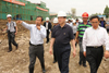 Mr Lam (centre) visits the construction site of the Giant Panda Conservation and Disease Control Centre in Dujiangyan, one of the reconstruction projects funded by the Hong Kong Special Administrative Region.