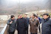 The Secretary for Development, Mr Paul Chan (second left), inspects the progress of works at the construction site of the China Conservation and Research Centre for Giant Pandas in Gengda Village today (March 5).