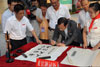 President of the LegCo Hon Jasper Tsang Yok-sing write a message in the form of calligraphy to encourage the students of Nanchong Shi Fu Jiang Lu Primary School.