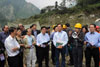 LegCo Members receive a briefing from an engineer on the progress of the construction work of the Provincial Road 303 Yingxiu to Wolong section.