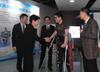 The Chief Executive, Mrs Carrie Lam, visited the University of Electronic Science and Technology of China (UESTC) in Chengdu this morning (May 12). Photo shows Mrs Lam (second left) greeting the person with disabilities using the assistive device (second right). Looking on are the Secretary for Constitutional and Mainland Affairs, Mr Patrick Nip (centre), and the Party Secretary of UESTC, Mr Wang Yafei (first left).