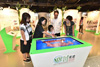 The Hong Kong Special Administrative Region's Post-quake Reconstruction Support Work in Sichuan roving exhibition is being held from today (October 29) to December 29 at various locations on Hong Kong Island and in Kowloon and the New Territories. Admission is free. All are welcome. Picture shows visitors receiving a briefing on the exhibition from a member of staff at the Youth Square in Chai Wan today.