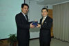 The Secretary for Justice, Mr Wong Yan Lung, SC (right) exchanges souvenirs with Deputy Director General of Chongqing Municipal Bureau of Justice, Mr Zhang Xiaotao, during a visit to the bureau today (August 12).