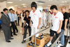 The Secretary for Food and Health, Dr York Chow (left), today (August 27) is glad to see two Beichuan Secondary School students walking again with the help of prostheses.