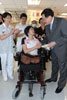 The Secretary for Food and Health, Dr York Chow (right), today (August 27) meets a Sichuan earthquake victims in Tai Po Hospital and was presented with a souvenir.