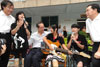 Persons undergoing rehabilitation treatment hold a singing performance during the visit of the Chief Secretary for Administration, Mr Henry Tang.