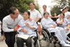 The Chief Secretary for Administration, Mr Henry Tang, meets the people receiving rehabilitation treatment at the rehabilitation centre dedicated to those injured in the earthquake.