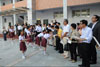 Students in Nanchong Baita Junior Middle School present thank-you cards to the LegCo Members.