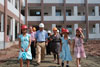 The Under Secretary for Education, Mr Kenneth Chen, accompanied by the General Manager of YMCA of Hong Kong, Dr Alice Yuk, inspects the construction progress at the site of the Jintang County YMCA Hong Kong School.