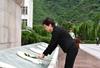 The Chief Executive, Mrs Carrie Lam, presents flower at a ceremony in commemoration of the massive Wenchuan earthquake at the former Xuankou Middle School in Yingxiu Town, Wenchuan County, Sichuan this afternoon (May 12).